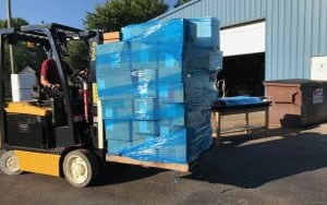 A forklift carrying medical supplies