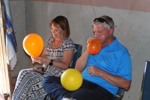 Jim and Ann Messenger blowing up balloons