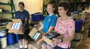 Volunteers helping to load supplies